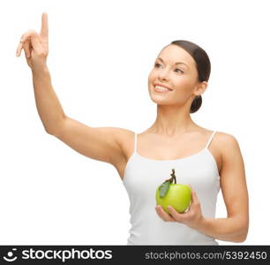 woman holding green apple and working with something imaginary