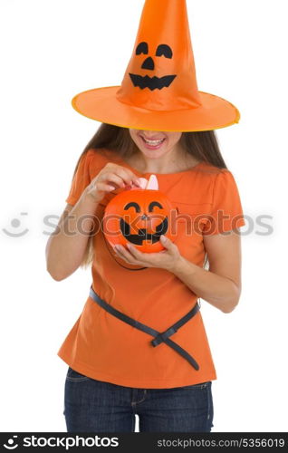 Woman holding Halloween bucket with sweets