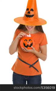Woman holding Halloween bucket with sweets