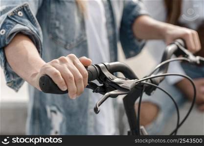 woman holding her bike