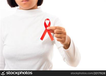 Woman holding HIV AIDS awareness red ribbon in studio shot isolated on over white background, Healthcare and medicine, World aids day concept