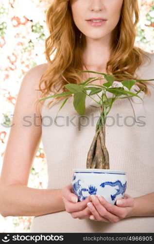 Woman holding houseplant