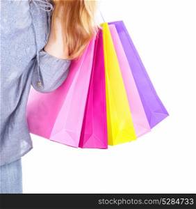 Woman holding in hand colourful shopping bags isolated on white background, body part, spending money in the store, sales concept