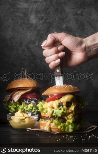 woman holding knife tasty hamburger