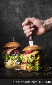 woman holding knife tasty hamburger