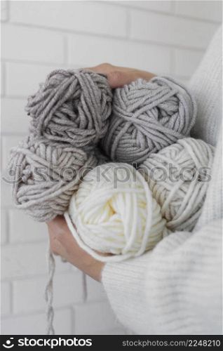 woman holding knitting wool close up