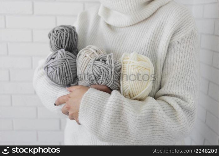 woman holding knitting wool close up 4. woman holding knitting wool close up 3