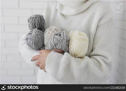 woman holding knitting wool close up 4. woman holding knitting wool close up 3