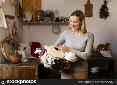 woman holding laundry basket medium shot