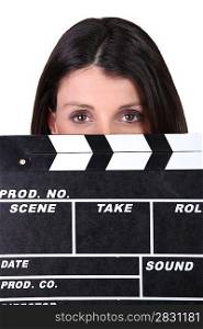 Woman holding movie clapper