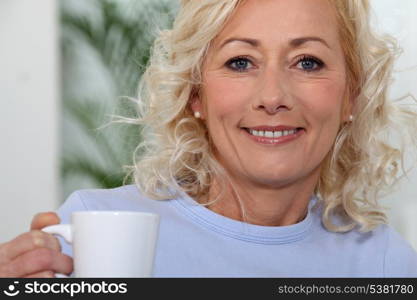 Woman holding mug of coffee