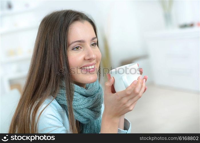 Woman holding mug of coffee