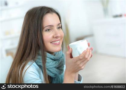 Woman holding mug of coffee