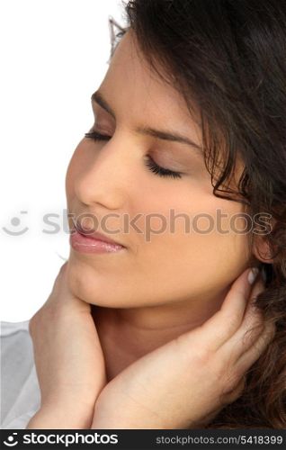 Woman holding neck