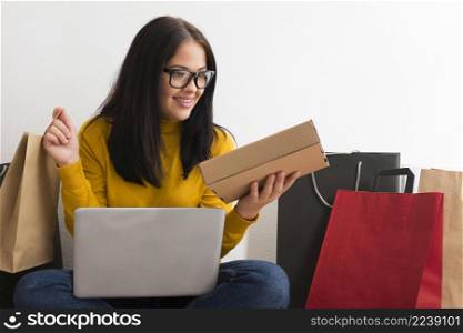 woman holding new packages from cyber monday sales with copy space