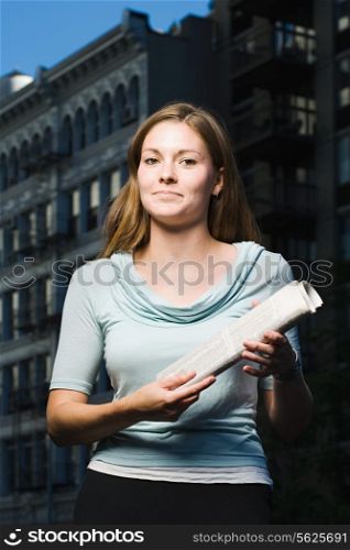 Woman holding newspaper