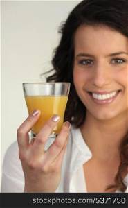 Woman holding orange juice
