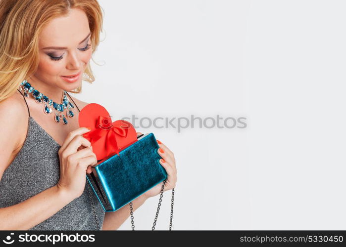 Woman holding paper heart. Portrait of glamorous woman holding red paper heart, valentine day concept