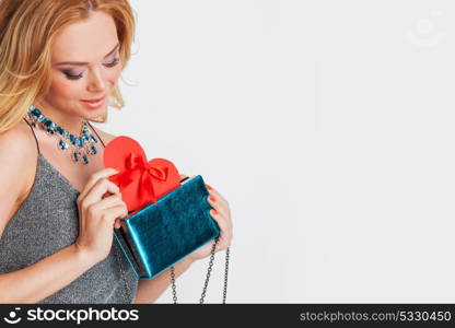 Woman holding paper heart. Portrait of glamorous woman holding red paper heart, valentine day concept