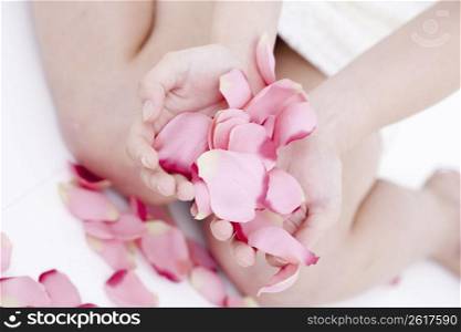 woman holding petals
