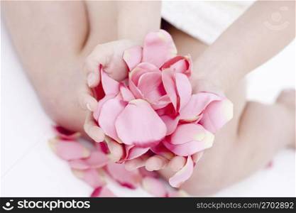 woman holding petals