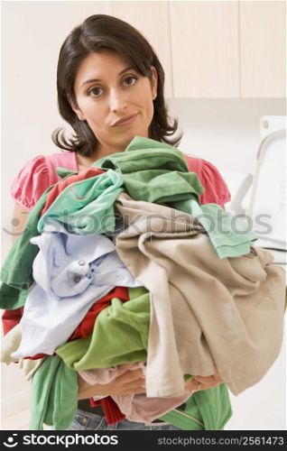Woman Holding Pile Of Laundry