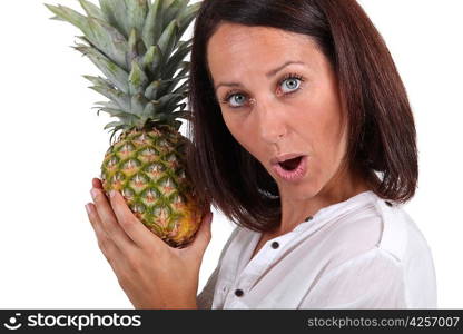 Woman holding pineapple