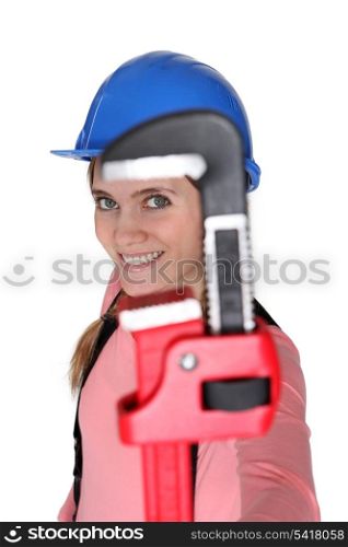 Woman holding pipe wrench