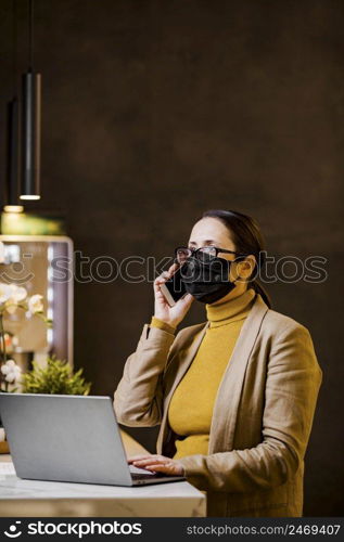 woman holding protective mask