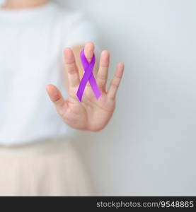 Woman holding purple Ribbon for Violence, Pancreatic, Esophageal, Testicular cancer, Alzheimer, epilepsy, lupus, Sarcoidosis and Fibromyalgia. Awareness month and World cancer day concept