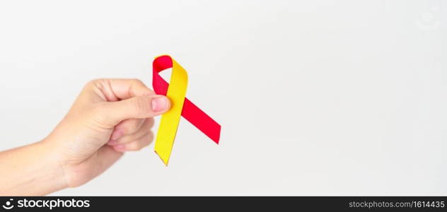 woman holding Red and Yellow ribbon. World hepatitis day awareness month, 28 July, Liver cancer, Jaundice, Cirrhosis, Failure, Enlarged, Hepatic Encephalopathy and Health concept