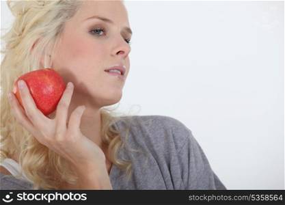 Woman holding red apple