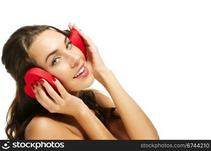 woman holding red heart shaped box on her ears. happy woman holding red heart shaped box on her ears on white background