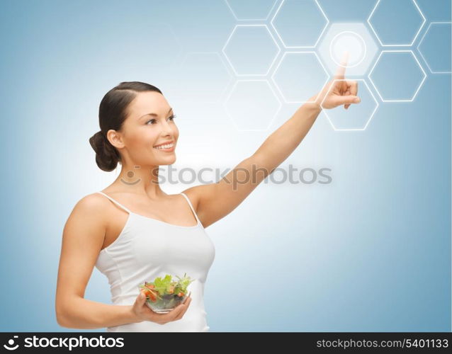 woman holding salad and working with virtual screen