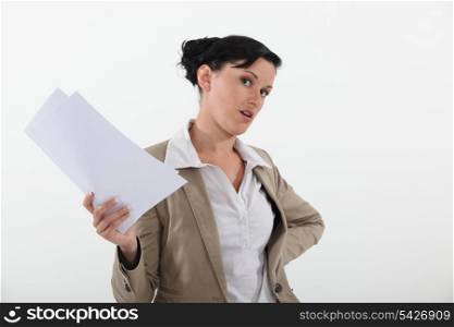 Woman holding sheets of paper