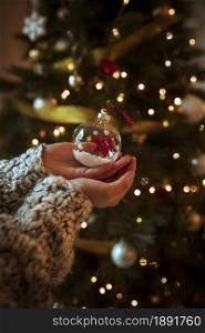 woman holding small bauble hand. Resolution and high quality beautiful photo. woman holding small bauble hand. High quality and resolution beautiful photo concept