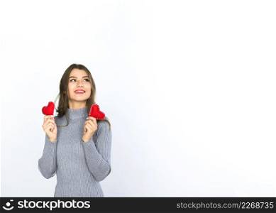 woman holding small hearts hands