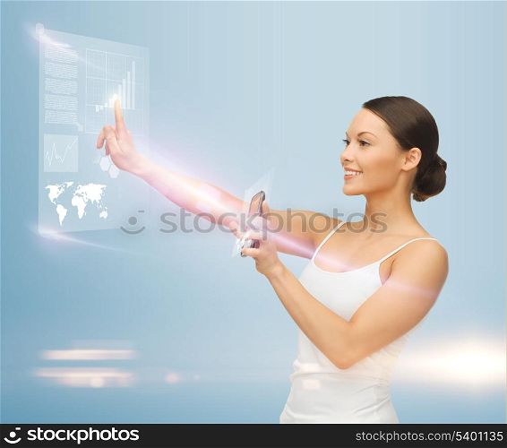 woman holding smartphone and working with virtual screen