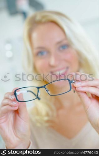 Woman holding some new glasses