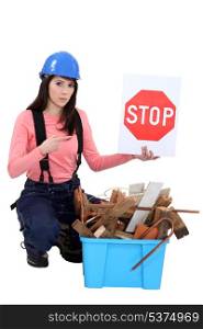 Woman holding stop sign