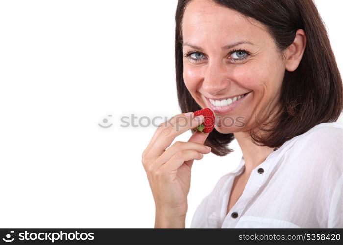 Woman holding strawberry