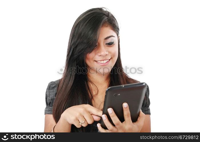 Woman holding tablet computer isolated on white background. working on touching screen. Casual smiling caucasian hispanic woman.
