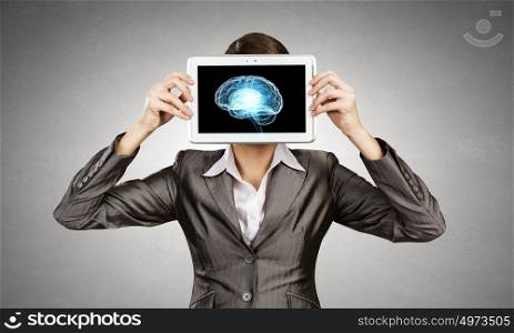 Woman holding tablet pc with brain concept. Mental ability