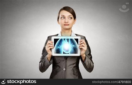 Woman holding tablet pc with lungs xray concept. X-ray of lungs
