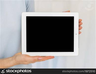 woman holding tablet with black blank screen. High resolution photo. woman holding tablet with black blank screen. High quality photo