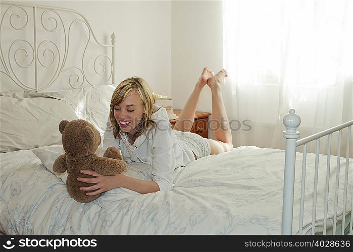 Woman holding teddy bear