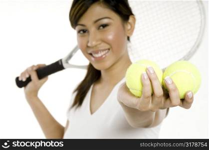Woman Holding Tennis Balls