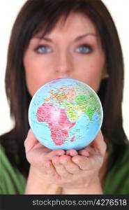 woman holding the globe