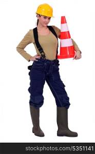 Woman holding traffic cone