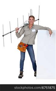 Woman holding TV antenna with white sign